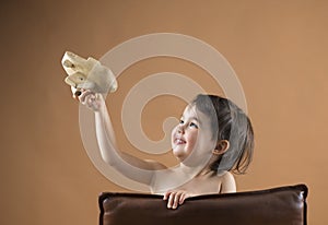 Happy kid playing with toy airplane