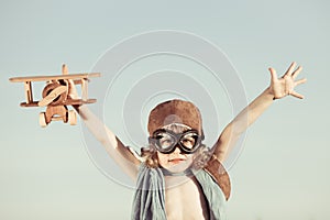 Happy kid playing with toy airplane