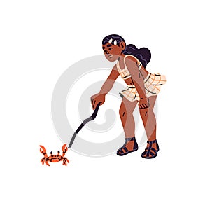 Happy kid plays with crab. Interested girl pokes with stick into sea animal. Curious child in cute swimsuit funs on