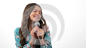 happy kid singer performing her song with microphone, music