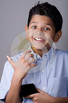 Happy kid or student with award.