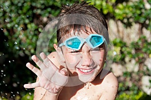 Happy kid in summer with water