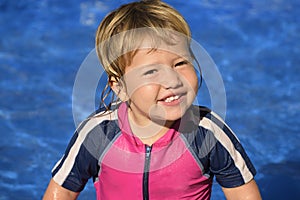 Happy kid in the swimming pool