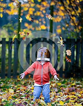 Happy Kid throwing leaves