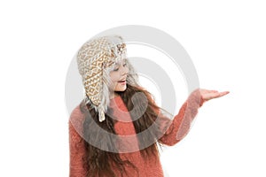 Happy kid wear earflap hat. christmas shopping. little girl long hair isolated on white. warm and cosy. perfect look for