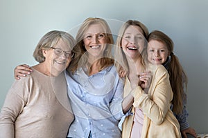 Happy kid, young mother, mature grandmother, senior great grandma portrait