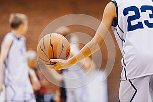 Happy Kids on Basketball Training Practice. Boy Playing With Basketball on Training Session