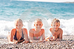 Happy kids on the beach having fun