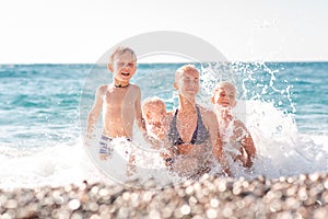 Happy kids on the beach having fun