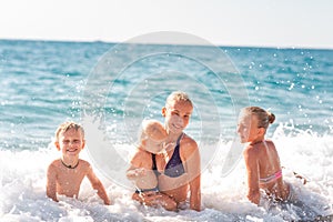 Happy kids on the beach having fun