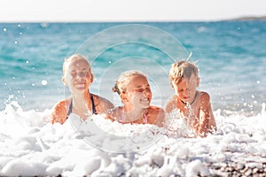 Happy kids on the beach having fun