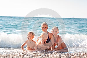 Happy kids on the beach having fun