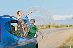 happy kids in car, family trip, summer vacation travel