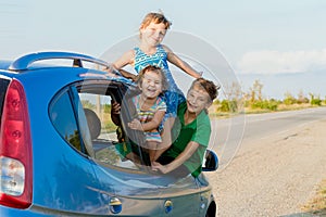 happy kids in car, family trip, summer vacation travel