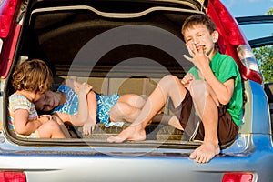 happy kids in car, family trip, summer vacation travel