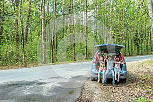 Happy kids in car, family trip, summer vacation travel