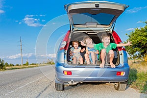 happy kids in car, family trip, summer vacation travel