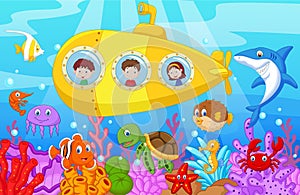 Happy kids cartoon in submarine on the sea photo