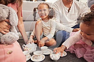 Happy, kids and children at play date have tea party, fun and playing together on home living room floor. Development