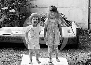 Happy kids doing arts and crafts together. Portrait of adorable little girl and boy smiling happily while enjoying art and craft.