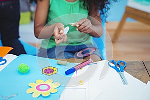 Happy kids doing arts and crafts together photo