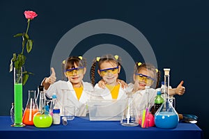 Happy kids doing science experiments in the laboratory.