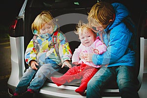 Happy kids enjoy travel by car, family vacation