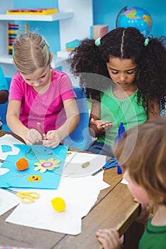 Happy kids enjoying arts and crafts painting