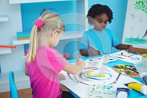 Happy kids enjoying arts and crafts painting