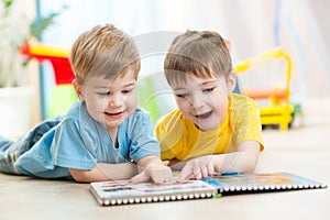 Happy kids friends reading together