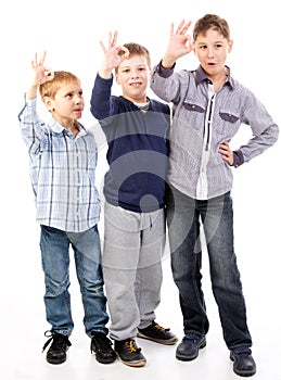 Happy kids giving ok sign