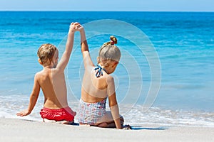 Happy kids have fun in summer camp on beach vacations