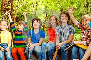 Happy kids having fun in the outdoor summer camp photo