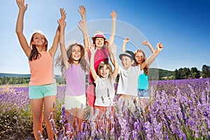 Happy kids having fun outdoors in lavender field