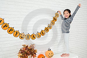 Happy kids help family to hang up decoration