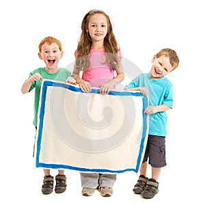 Happy kids holding blank painted sign