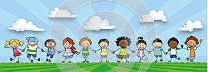 Happy kids holding hands, children playing on meadow