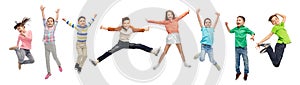 Happy kids jumping in air over white background photo