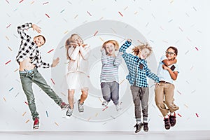 Happy kids jumping photo