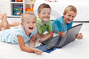 Happy kids with laptop computer