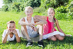 Happy kids laying on grass