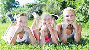 Happy kids laying on grass