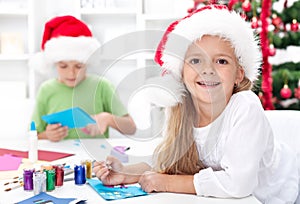 Happy kids making christmas cards