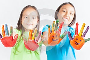 Happy kids with painted hands. International Children's Day