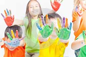 Happy kids with painted hands. International Children's Day