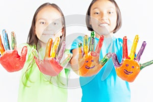 Happy kids with painted hands. International Children's Day