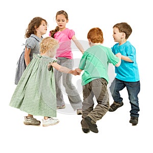 Happy kids playing circle game