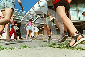 Happy kids playing at city`s street in sunny summer`s day