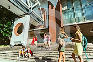 Happy kids playing at city`s street in sunny summer`s day