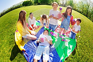 Happy kids playing with colorful balls in the park